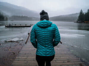 Woman walking towards lake